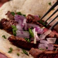 Steak Tacos · Steak tips, serrano pepper and jalapeno peppers, avocado and cilantro. Includes Flour or Cor...