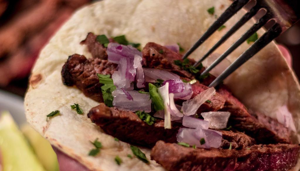 Steak Tacos · Steak tips, serrano pepper and jalapeno peppers, avocado and cilantro. Includes Flour or Corn tortillas