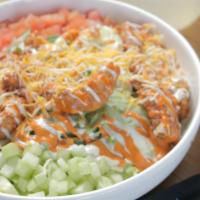 Buffalo Salad · Iceberg and Romaine lettuce topped with Buffalo Chicken Strips, cucumber, tomato, cheese mix...