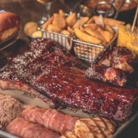 Half Bbq Tray (2-3 People) · Baby Back Ribs, pulled pork , Chicken, Brisket, Sausage Bites, Steakfries, Corn on the Cob a...