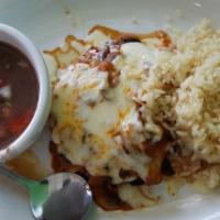 Pollo Ixtapa · Grilled chicken breast, smothered with Oaxaca cheese, mushrooms, and topped with a tomato-ha...