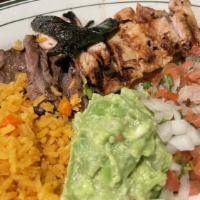 Fajitas · Charbroiled.  Served with guacamole, pico de gallo, mexican rice, charro beans, and choice o...