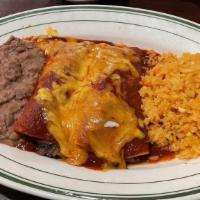 Tradicionales · Choice of ground beef or shredded chicken. Topped with Guajillo sauce and Oaxaca cheese, ser...