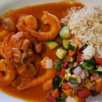 Camarones Chipotle · Large shrimp pan-seared with olive oil and fresh garlic, mushrooms, and braised in a roasted...