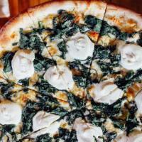 White Pie With Spinach · Extra virgin olive oil, garlic, ricotta and mozzarella.