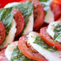 Insalata Caprese · Roma tomatoes, basil, fresh mozzarella and extra virgin olive oil.