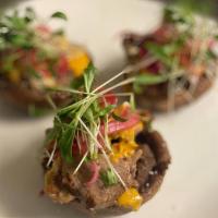 Chef George'S Sopes · Fried potato masa cakes topped with black beans, Carnitas or Short Rib, spicy almond sauce, ...