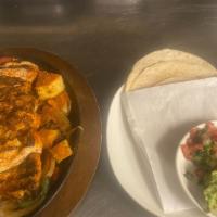 Marinated Chicken Breast · Served with black beans & Maria's rice, guacamole, pico de gallo, and house-made tortillas.