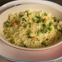 Maria'S Rice · Traditional Central Mexican rice, served with peas carrots and corn, with a touch of butter.