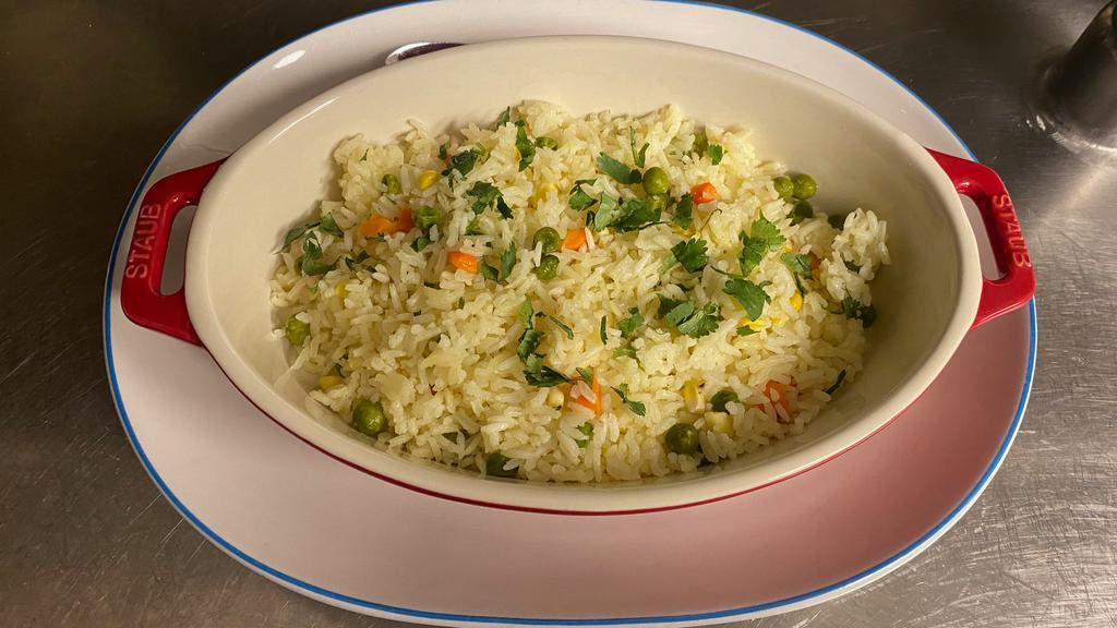 Maria'S Rice · Traditional Central Mexican rice, served with peas carrots and corn, with a touch of butter.