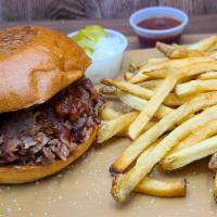 Bbq Brisket Sandwich · SMOKED BRISKET TOSSED IN BBQ SAUCE W/ PICKLES AND ONIONS.  FRIES INCLUDED