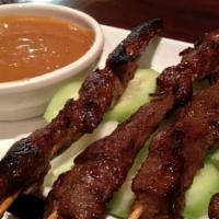Beef Satay · Four pieces of marinated beef on skewers grilled to perfection. Served with peanut sauce.