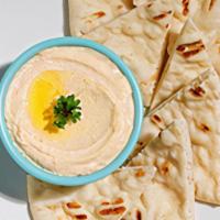 Hummus With Grilled Pita · comes with 8oz hummus and 2 side pitas (for extra pita, add in sides $)