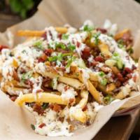 Garlic Parmesan Fries With Bacon · Seasoned fries, Garlic Parmesan Sauce, Crispy Bacon & Parmesan Cheese, Topped with Green Oni...