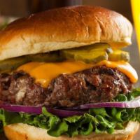 All-American Pub Burger · Aged cheddar cheese, applewood bacon, lettuce, tomato, pickle on a butter brioche bun.