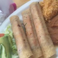 Flautas · Rolled chicken tacos.