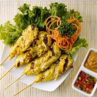 Chicken Satay · Tender strips of chicken marinated in spices and grilled on skewers,. served with traditiona...