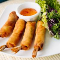 Shrimp Blankets · Marinated shrimp with carrots and cilantro, wrapped in a thin rice wrapper, then deep-fried....