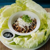 Lemongrass Lettuce Wraps · Minced chicken or tofu, lemongrass, red and white onion, and water chestnuts. Served with ic...