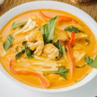 Red Curry · Red curry sauce, simmered with coconut milk, bamboo shoots, red and green bell peppers, and ...
