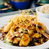 Tamarind Shrimp · Jumbo Shrimp lightly battered and deep fried. Served with caramelized onions over a tasty ta...