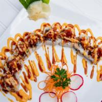 Volcano Roll · Inside: crab stick, avocado, and cucumber
outside: rice, sesame seeds, tobiko, chef's sauce,...