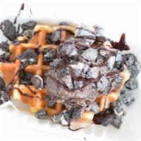 .O..M..G.. · Toasted Belgian waffle with oreo icing, oreo pieces, chocolate sauce and powdered sugar.
