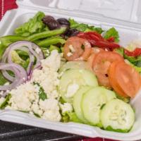 The Greek · Fresh chopped romaine lettuce topped with fresh English cucumber, sliced green bell peppers,...