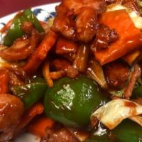 回锅肉  / Double Sautéed Sliced Pork · Spicy. Sliced pork with spring onions, green peppers, bamboo shoots, carrot, and cabbage in ...