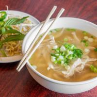 Chicken (White Meat) - Gà · White meat. Choice of traditional beef or vegetable broth. Served with rice noodles, green o...