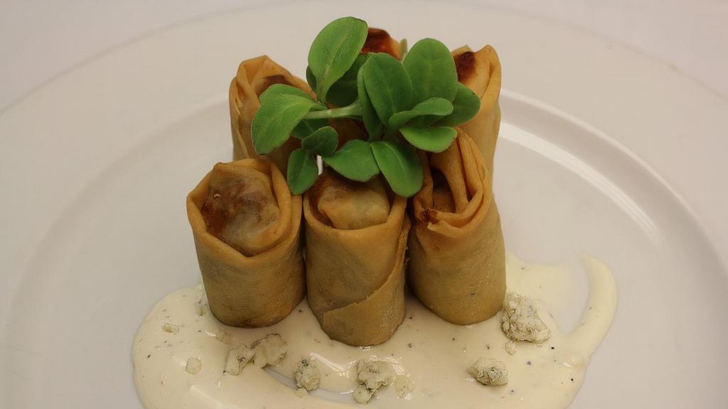 Buffalo Chicken Spring Rolls · Served with blue cheese.
