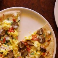 Breakfast Pizza · Topped with an egg, breakfast sausage, mozzarella cheese, provolone cheese, green onions, an...