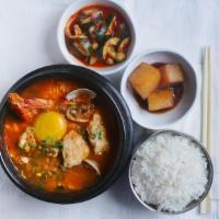 Haemul Sundubu · Spicy Beef Broth, Soft Tofu, Shrimp, Clams, Green Onion, Raw Egg*