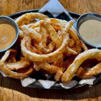 *Hand Battered Thin Cut Onion Strings · Heaping serving of hand battered, thin-cut, deep fried onion rings