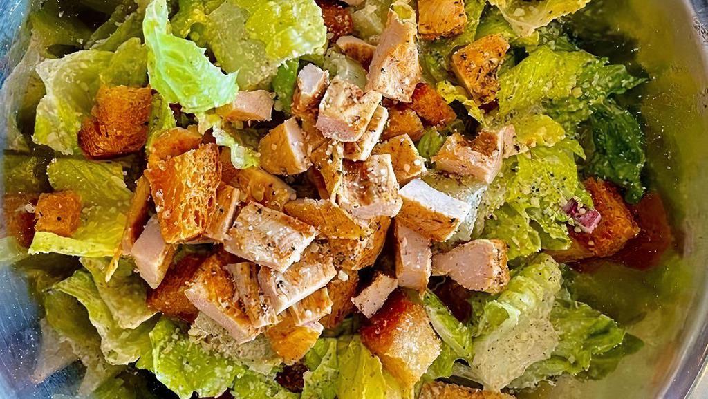 *Grilled Chicken Caesar. · Chopped lettuce, house-made croutons, diced onions, shaved parmesan, grilled chicken breast. tossed in House-made Caesar dressing.