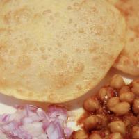 Chhole Poori · Vegan: Chole masala is a popular Punjabi dish where chickpeas are simmered in a spicy and ta...