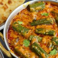 Bhindi Masala · Vegan. Deep fried bhindi (okra) mixed with gravy based on tomato, onions, garlic and other I...