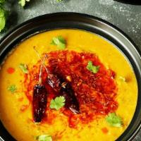 Yellow Dal Tadka · Vegan: Yellow lentils cooked to perfection, tempered with red chilies, mustard seeds and cur...