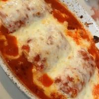 Cannelloni · Pastas rolled and stuffed with chicken and spinach, topped with marinara and mozzarella chee...