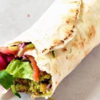 Falafel Wrap · Comes with Lettuce, Tomatoes, Onions, Pickles and Falafel Wrapped in Pita Bread.