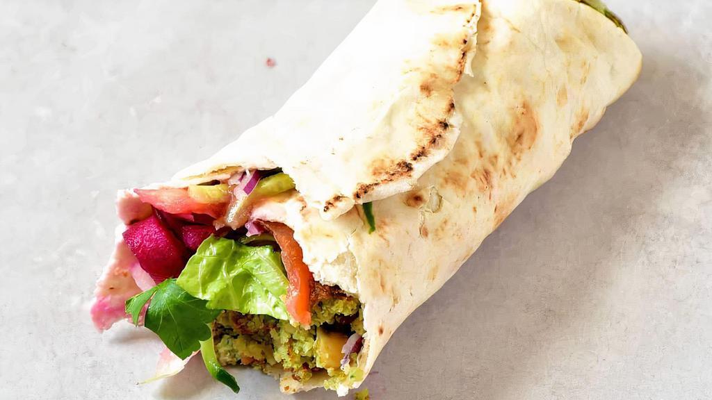 Falafel Wrap · Comes with Lettuce, Tomatoes, Onions, Pickles and Falafel Wrapped in Pita Bread.