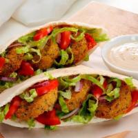 Falafel Pocket · Comes with Lettuce, Tomatoes, Onions, Pickles and Falafel Wrapped in Pocket Bread.
