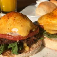 Hot Chorizo Benedict · Two poached eggs, chorizo sausage, fresh spinach, and grilled tomatoes on a toasted English ...