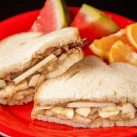 Fruit-Wich · Peanut butter, golden raisins, sliced apples, bananas and agave nectar on your choice of bre...