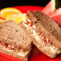 Cruncher · PB&J with sliced apples and agave nectar on your choice of bread/wrap.