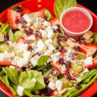 Berries & Spinach Salad · Baby spinach, feta cheese, dried cranberries, grapes, strawberries and almonds with your cho...