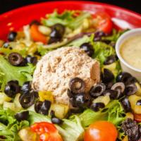 Tuna Salad · White albacore tuna mix, mixed greens, black olives, pickles and cherry tomatoes with your c...