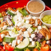 Refresher Salad · Mixed greens, feta cheese, black olives, cucumbers, garbanzo beans, cherry tomatoes, and pec...