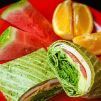 Green Gobbler · Sliced oven gold turkey, swiss cheese, baby spinach, avocado, tomatoes and hummus on your ch...