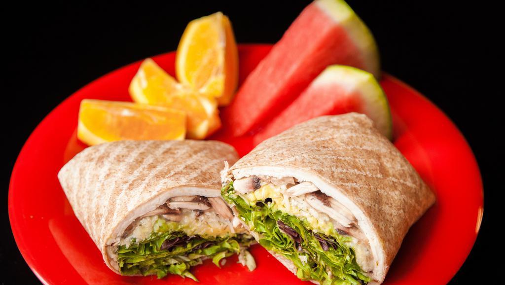 Chicken Caesar · Sliced deli chicken, Parmesan cheese, mixed greens, avocado, mushrooms and caesar dressing on your choice of bread.